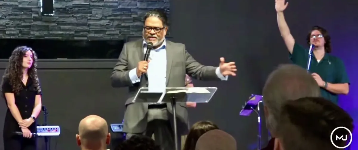A preacher teaching from the clear pulpit